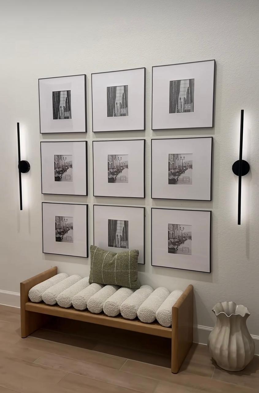 Symmetrical black-framed gallery wall
