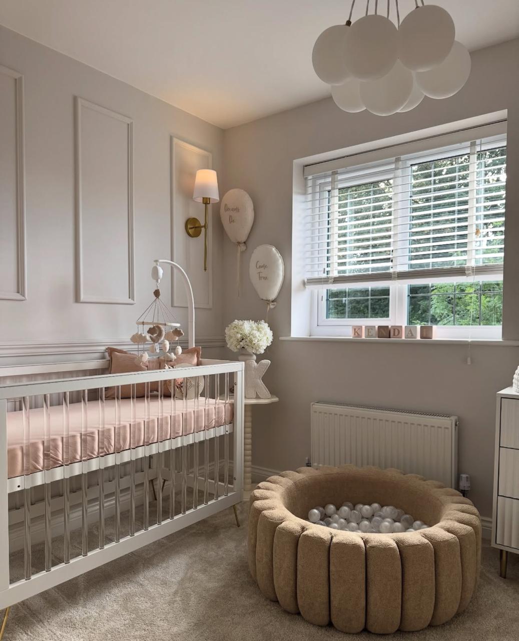 Neutral nursery with panelled walls